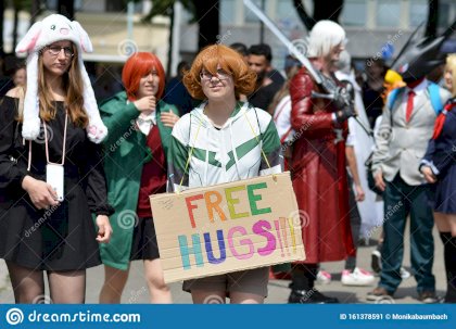 woman-cosplaying-trainer-pidge-free-hugs-sign-pokemon-franchise-walking-though-public-park-manga-cnvention-161378591.jpg