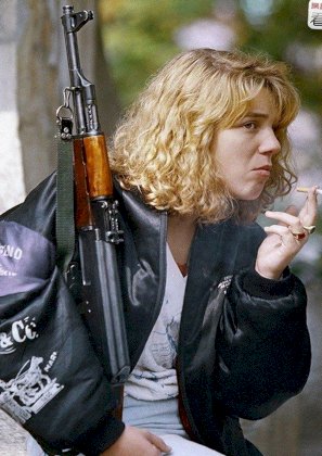 bosnian-woman-holding-an-ak-47-rifle-and-smoking-a-v0-5lxyv6ieteib1.jpg