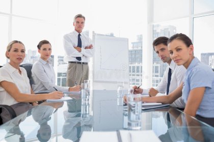 serious-business-people-looking-camera-meeting-room-31667458.jpg