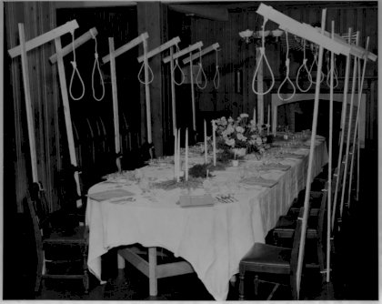 nooses-over-seats-at-the-dining-table-of-condemned-nazis-at-nuremberg.jpg
